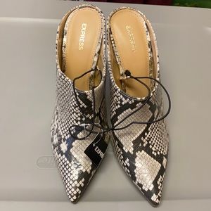 Express multi colored half silhouette heels boots.